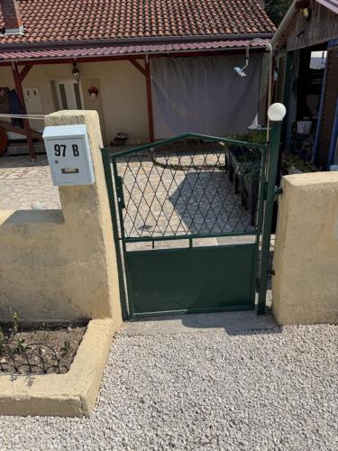 a gate with a speed limit sign on it at Casa Regina in Crno