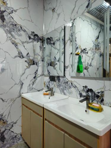 a bathroom with a sink and a mirror at БорБор in Osh