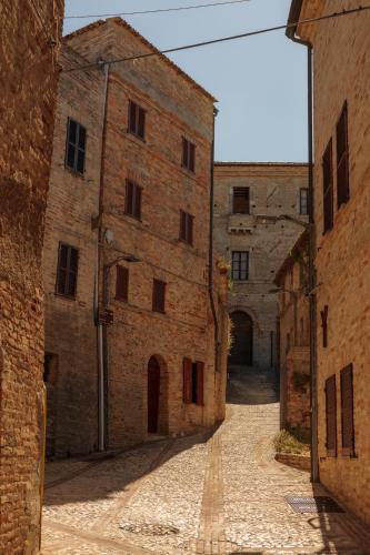 an alley way in an old brick building at Castello Di Marà in Cupra Marittima