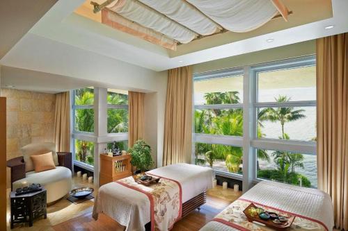 a bedroom with two beds and a large window at Mandarin Oriental Miami in Miami