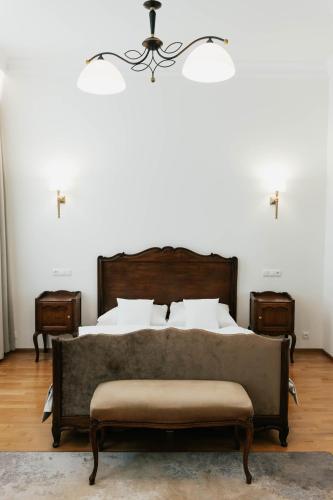 a bedroom with a bed and two night stands at Hotel Pod Zeleným Dubem in Bohumín