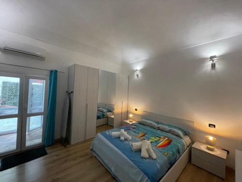 a bedroom with a bed with towels on it at Priamar house in Savona