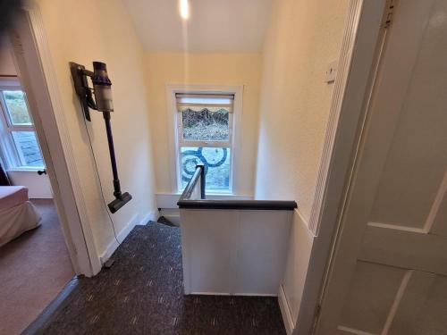 an empty hallway with a door and a window at Bayview in Ballysadare