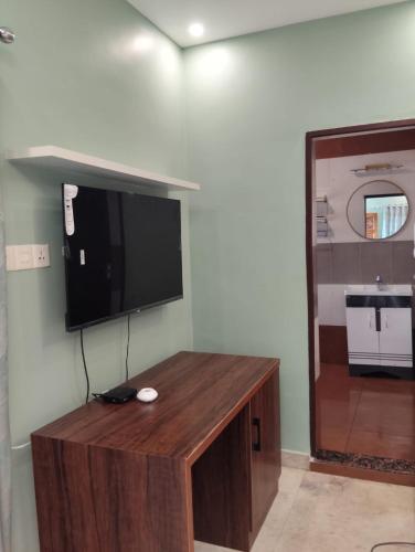 a flat screen tv hanging on a wall at Hillview Beach Resort in Varkala
