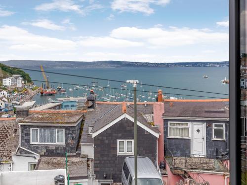 a view of a harbor from a building at Wrens Perch in Brixham