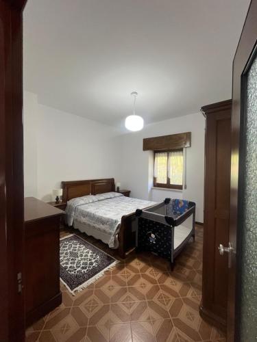 a bedroom with a bed and a window at La Terrazza sul Trebbia in Ottone