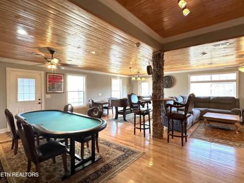 a living room with a pool table in it at Cove Manor in Maynardville