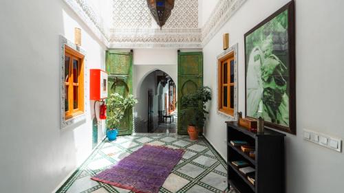 a hallway with a tile floor and a ceiling at Riad Ghali Hotel & SPA in Marrakesh