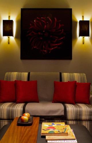 a living room with a couch and a table at Hotel Dighton in Oliveira de Azemeis