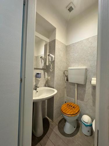 a bathroom with a toilet and a sink at Hotel Vintage Milano Centrale in Milan