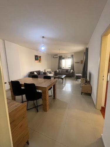 a living room with a table and a couch at Haidar house in Baabda