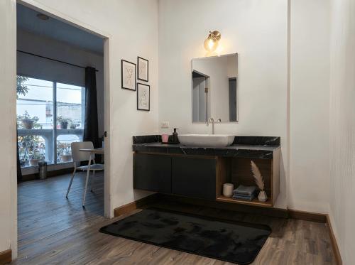 a bathroom with a sink and a mirror at Zen Ocean Villa -Sri Thanu in Ko Phangan