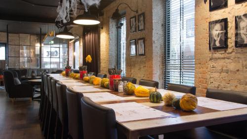 a long table in a restaurant with pumpkins on it at Best Western Hotel Herman Bang in Frederikshavn