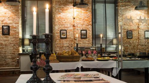 a room with a table with food on it at Best Western Hotel Herman Bang in Frederikshavn