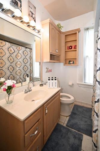 a bathroom with a sink and a toilet at Sunny Haven House in Jersey City