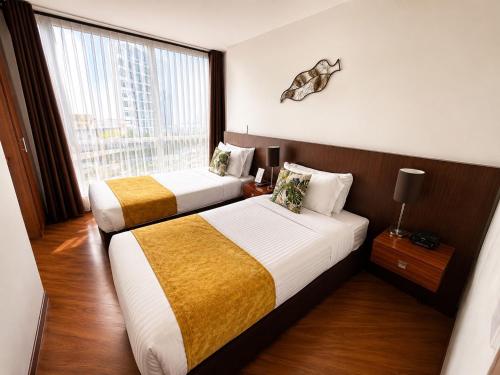 เตียงในห้องที่ Hotel Casa Galvez