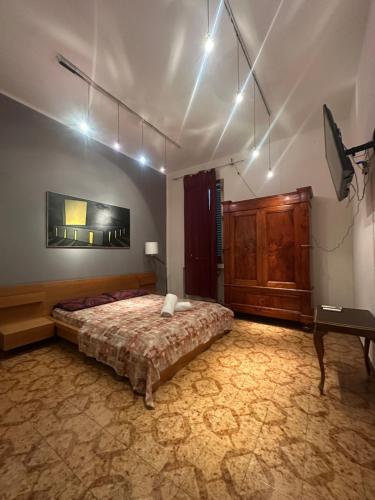 a bedroom with a bed and a table in a room at Bnb fantasia in Bologna