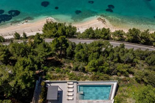 an aerial view of a house with a swimming pool at Multiverse in Podstrana