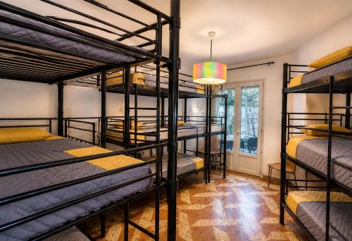 a group of bunk beds in a room at Hostel-Élisée-Perpignan in Perpignan
