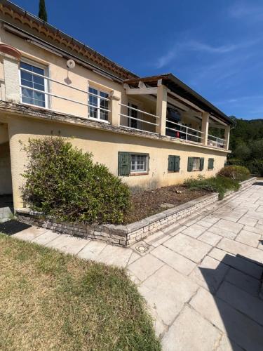 a house with a walkway in front of it at L'Échappée Cévenole in Gagnières