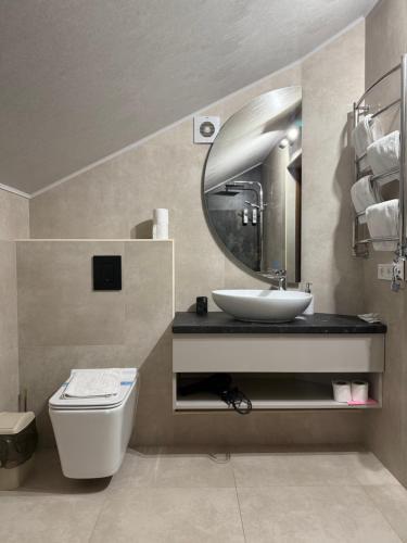 a bathroom with a sink and a mirror at Готель-ресторан Два Леви in Slavske