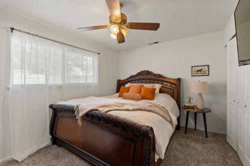 a bedroom with a bed with a ceiling fan at Gonzolez Apartments in Zamboanga