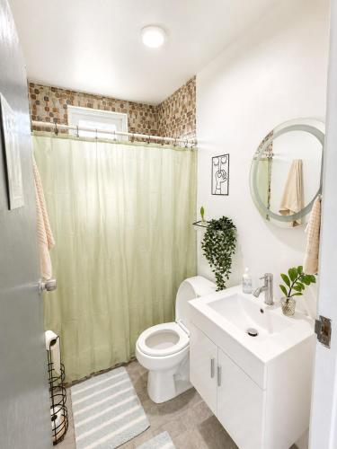 a bathroom with a toilet and a sink and a mirror at Finca Sol y Sal 
