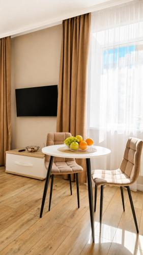 a table with fruit on it in a living room at Студия ЖК "Кенесары" in Kokshetau