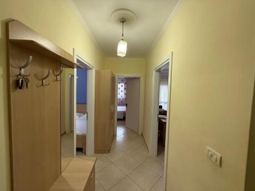 a hallway with a hallway leading to a bedroom at Daniels apartment in Shëngjin