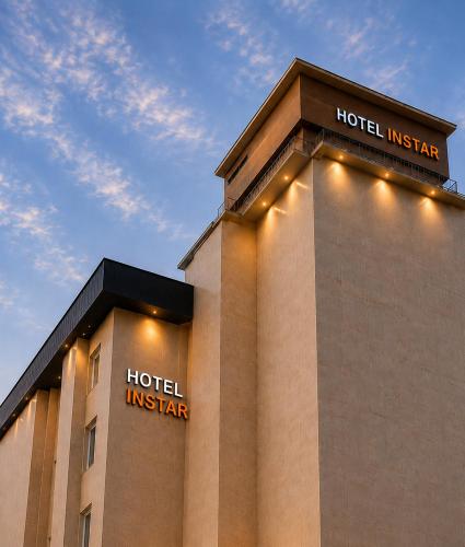 a hotel with lights on the side of a building at Instar Hotel in Suwon