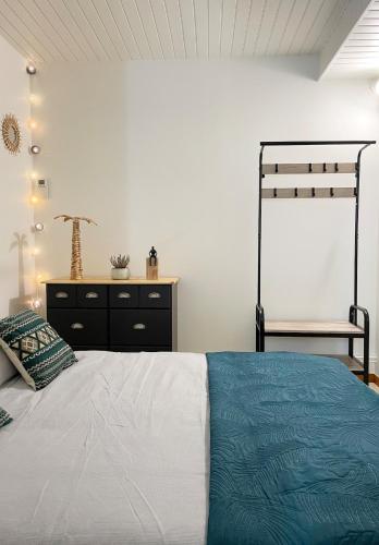 a bedroom with a bed and a dresser at Petite escapade dans le Perche 1 in Sainte-Céronne-lès-Mortagne