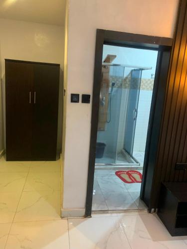an open door in a room with a glass at ffa resort centre in Akure