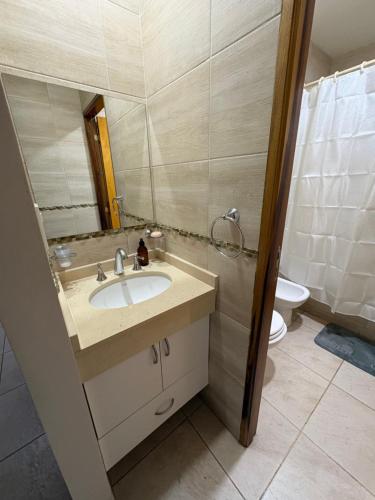 a bathroom with a sink and a toilet at ALOJAMIENTO NORTE SGO in Santiago del Estero