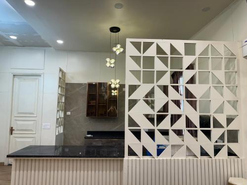 a room with a wall with a partition with at Sukoon Farms in Greater Noida