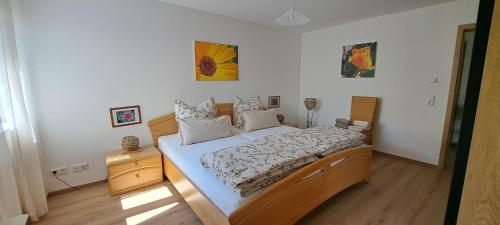 a bedroom with a large bed in a room at Eichkobel-Blick in Grünenbach