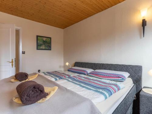 a bedroom with a bed with towels on it at Ferienhaus in Tönning in Tönning