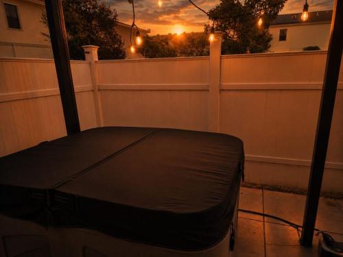 a balcony with a black cover on a fence at Casa Lux in Florida City