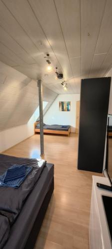 a room with a bed in the middle of a room at FeWo Altstadt Herrieden in Herrieden