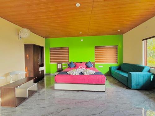 a green bedroom with a bed and a couch at Mount Ocio Pool Resort Wayanad, Chulliyode in Ambalavayal
