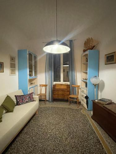 a living room with a couch and a window at Baia Serena in Sestri Levante