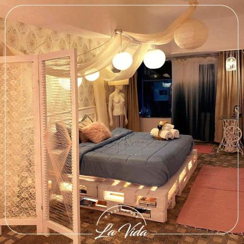 a bedroom with a bed with a canopy at La Vida Dahab in Dahab