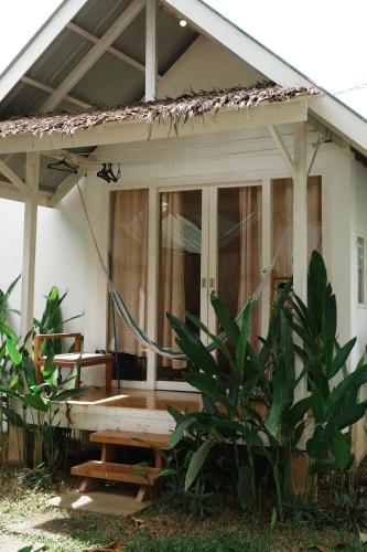 a house with a hose on the front of it at Verde Bungalows Siargao in General Luna
