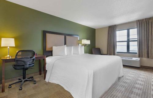 a hotel room with a bed and a desk and a chair at Extended Stay America Suites - Austin - Southwest in Austin