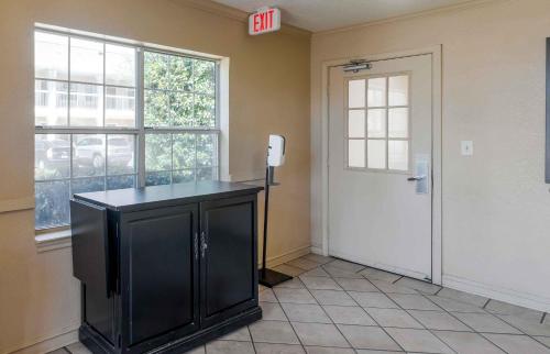 a room with a black cabinet and a door at Extended Stay America Select Suites - Atlanta - Perimeter - Hammond Drive in Atlanta