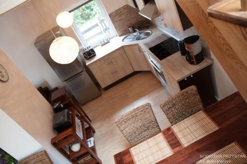 an overhead view of a kitchen with a stove top oven at Bobrowa Przystań in Czechyń