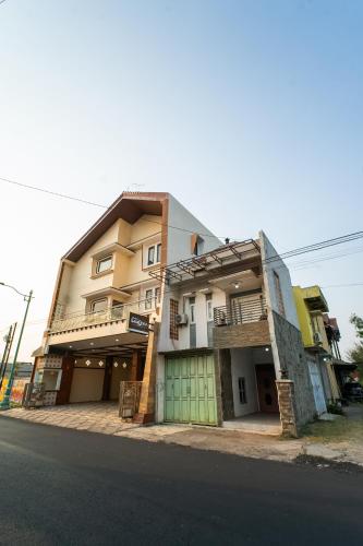 a building on the side of a street at Bintang Samudra Hotel in Jepara