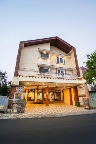 a building on a street with the front of it at Bintang Samudra Hotel in Jepara