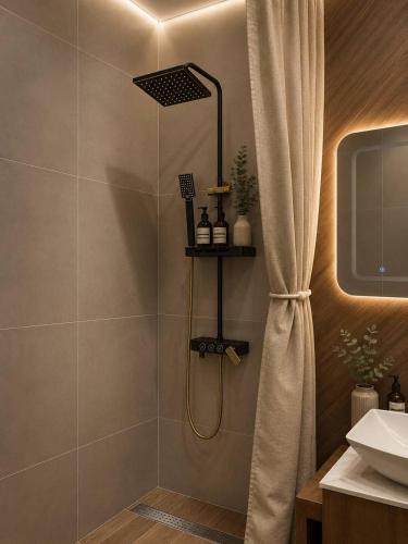 a bathroom with a shower with a shower curtain at Elim-Ai in Kokshetau