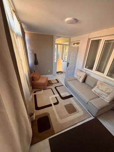 a living room with a couch and a chair at Issyk-Kul in Balykchy