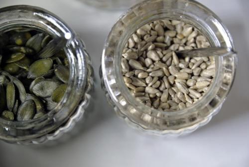two glass jars filled with seeds on a table at Best Western Hotel Armando in Verona